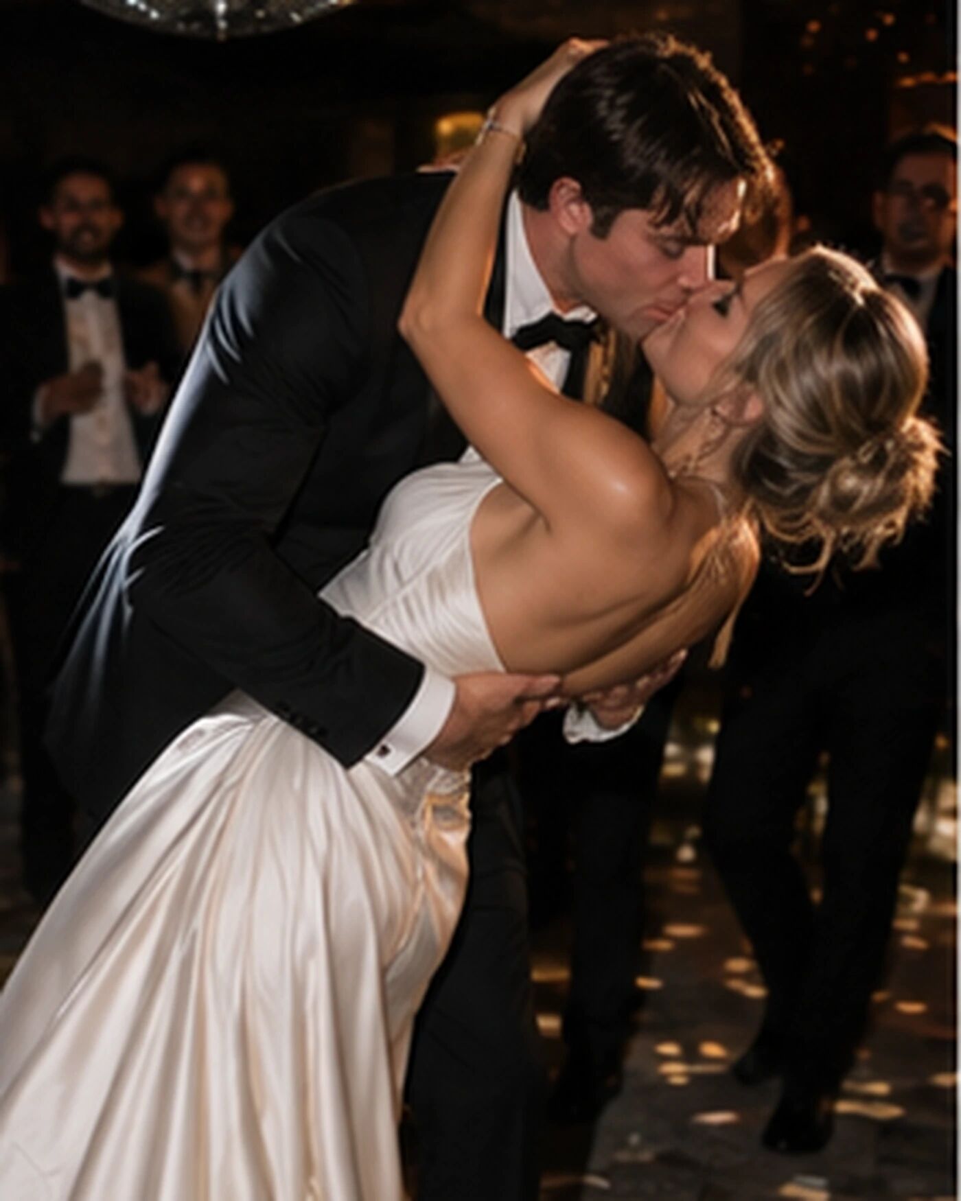 A couple kissing at a wedding