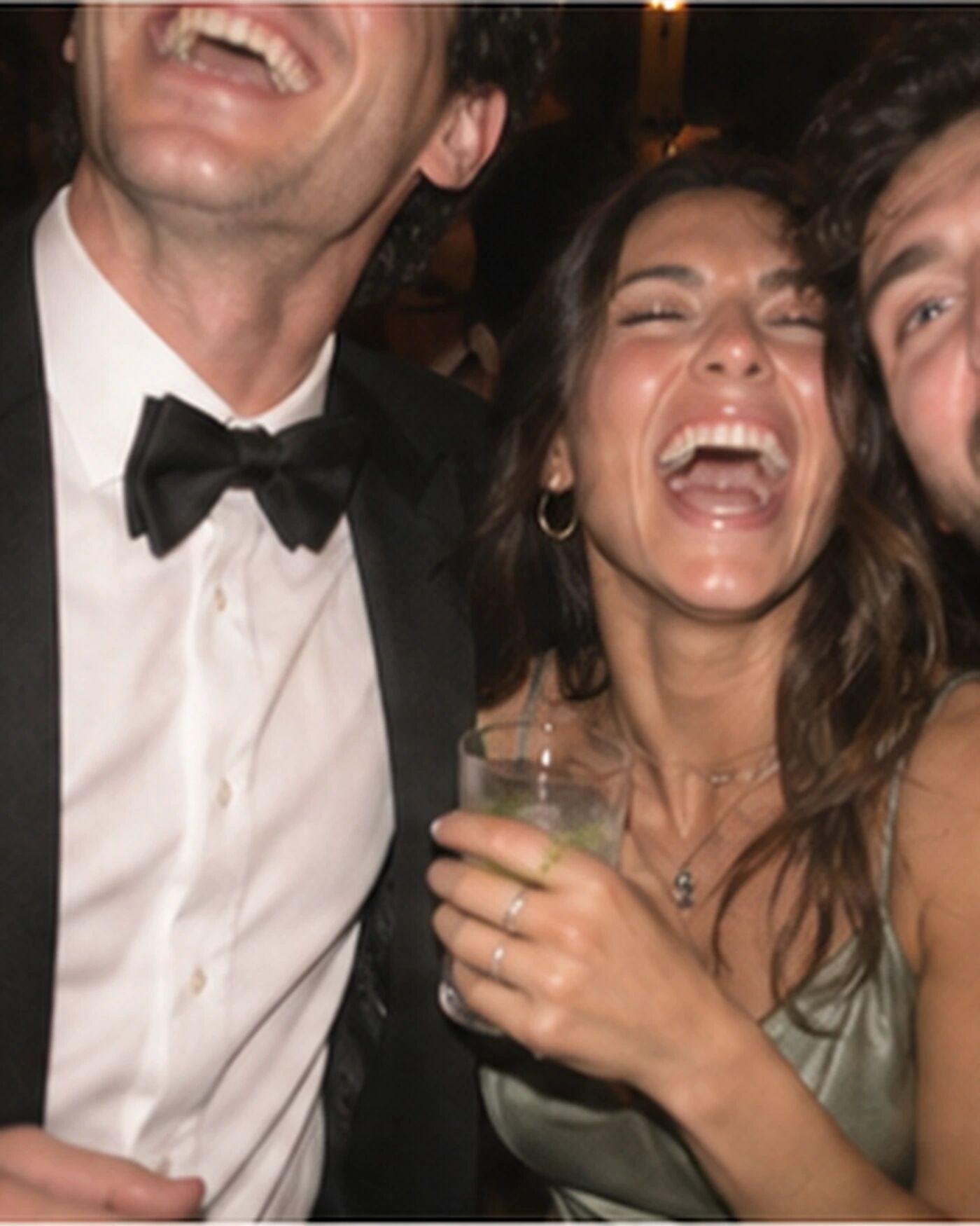 A tightly cropped, laughing group, kept exactly as taken